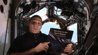 Expedition 37/38's Mike Hopkins reads "Max Goes to the Space Station" (Big Kid Science, 2013) by Jeffrey Bennett.