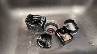Washing the removable parts of a Nespresso coffee machine