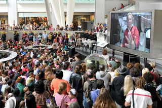 STS-135 Astronauts Watch Video Screen During Public ASTS-135 Astronauts Watch Video Screen at American Museum of Natural Historyppearance