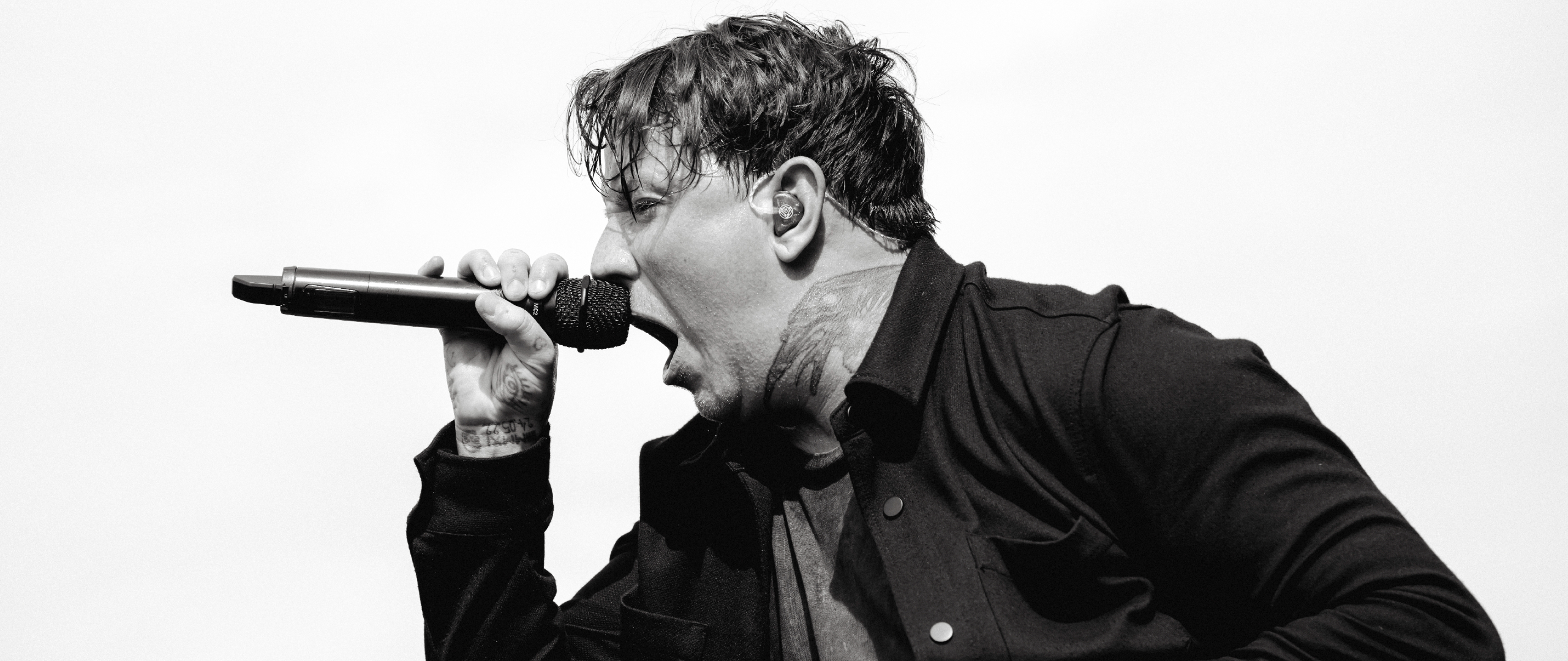 Scott Kennedy of Bleed From Within singing onstage in 2024