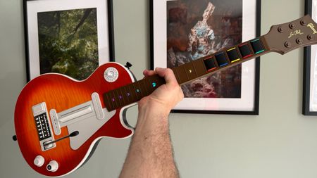 The reviewer holding the CRKD Gibson Les Paul Pro Edition Guitar