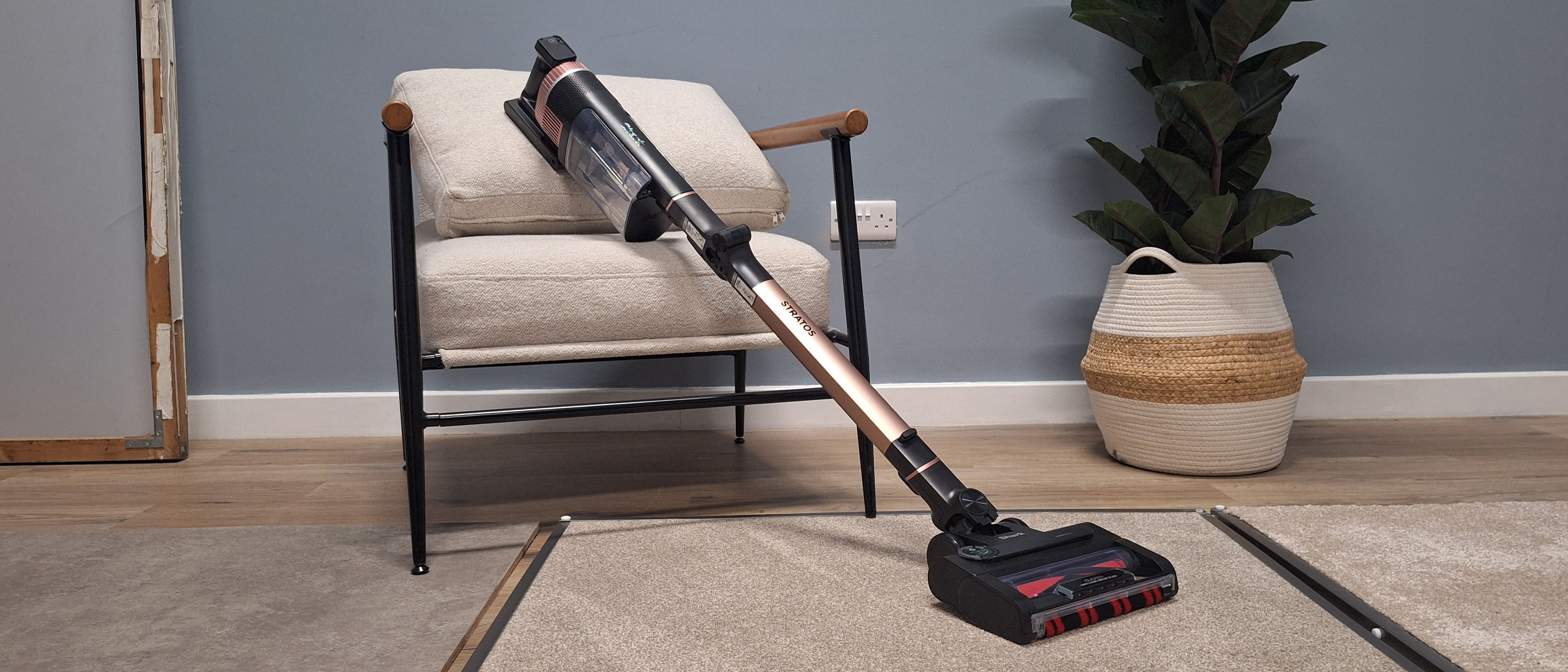 Shark Stratos IZ400 cordless vacuum in testing studio with floor samples