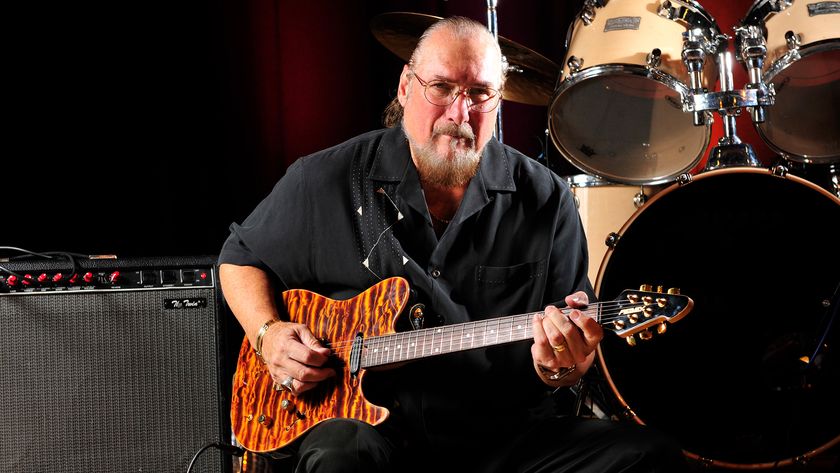 Steve Cropper poses with his Peavey signature guitar and a Fender Twin combo