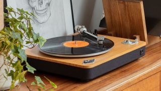 Best budget turntables: The House Of Marley Stir It Up turntable photographed on a wooden cabinet