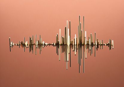 gold bars of different sizes made to look like a stock chart with a burnt orange background