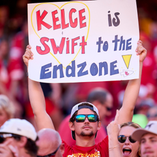 A fan holds a sign supporting Taylor Swift and Travis Kelce as the Kansas City Chiefs play the Chicago Bears during the first half at GEHA Field at Arrowhead Stadium on September 24, 2023
