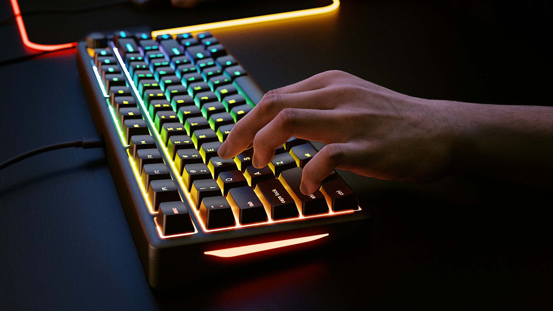 Hands using Glorious GMBK 75% gaming keyboard on a desk