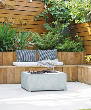 Built in bench seating with raised bed and outdoor fire