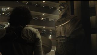 Loki looks on at a statue of Kang the Conqueror in Marvel's Loki episode 6