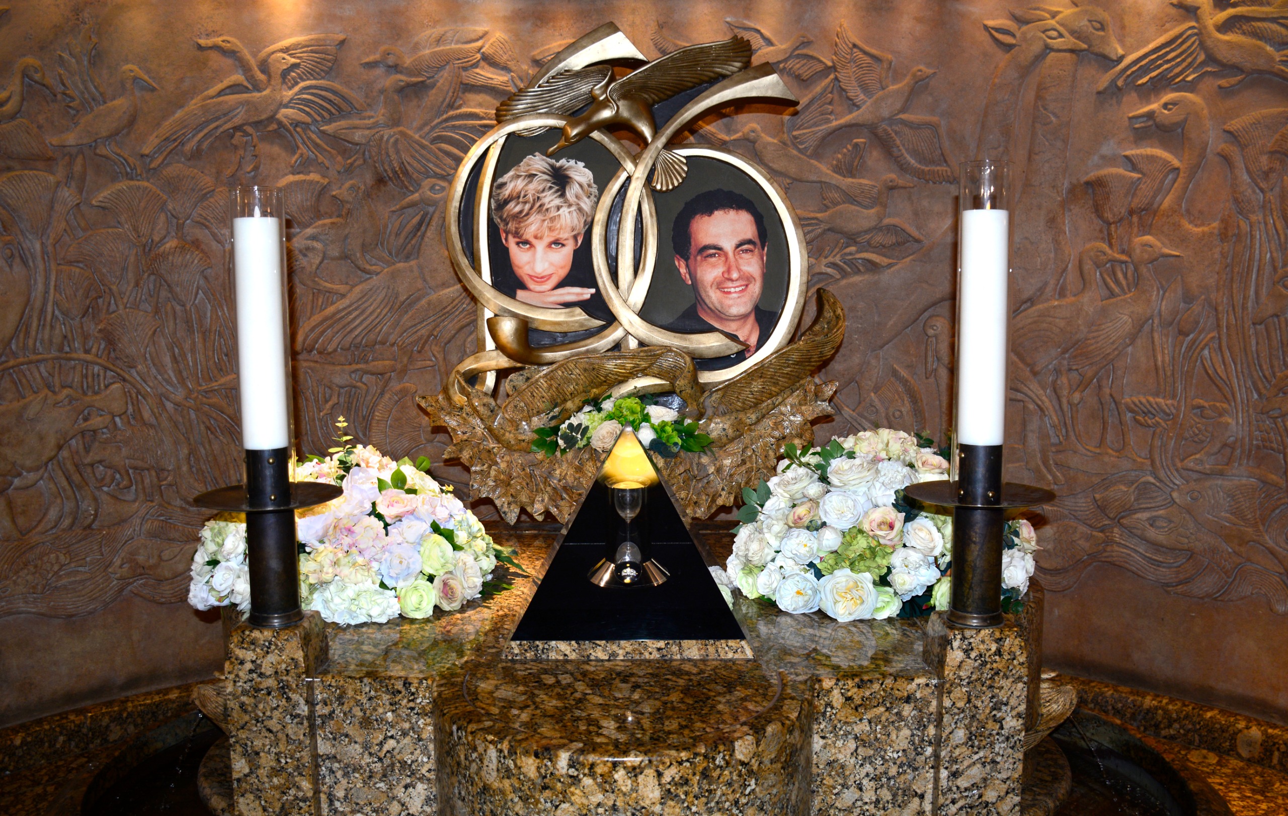 A memorial at Harrods in London featuring Diana and Dodi Fayed's photos