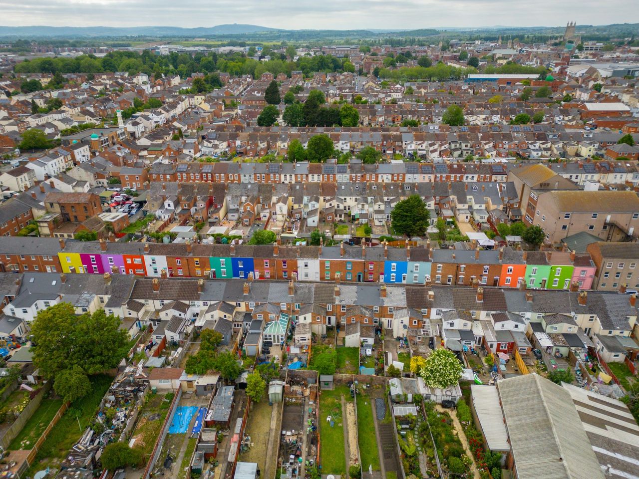 An overhead of the rows of houses with the coloured ones standing out