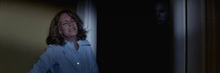 Halloween Jamie Lee Curtis Laurie waiting in the darkness with Michael looming