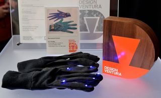 A photo of black gloves which have illumination elements.
