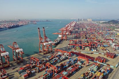 QINGDAO, CHINA - MAY 28: Aerial view of containers sitting stacked at Qingdao Port on May 28, 2019 in Qingdao, Shandong Province of China. (Photo by Han Jiajun/Visual China Group via Getty Im