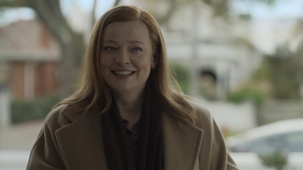 Sarah Snook smiling in the first scene from All Her Fault