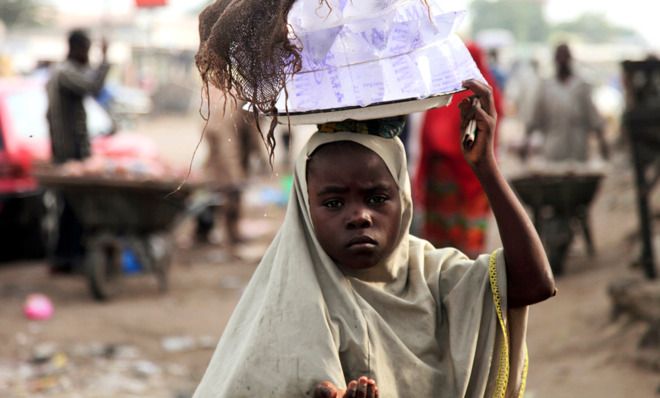 Girl hawking water.