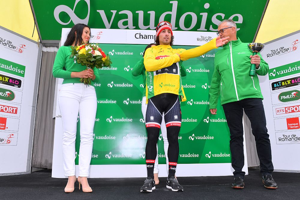 Fabio Felline (Trek-Segafredo) puts on the leader's jersey after stage 1 at Tour de Romandie