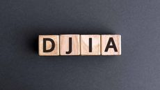 Dow Jones Industrial Average acronym, DJIA, written on wooden blocks