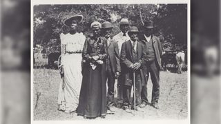 Black and white photo of African Americans celebrating Juneteenth in 1900