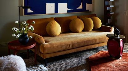 a green living room with a yellow couch