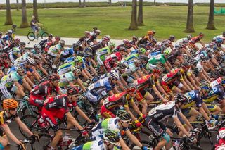 A local watches the bunch speed along on Stage 5 at California