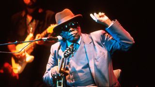 John Lee Hooker performs on stage, London, circa 1996