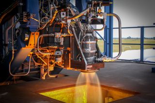 A SpaceX SuperDraco rocket thruster undergoes a test fire at the company's McGregor, Texas proving ground.