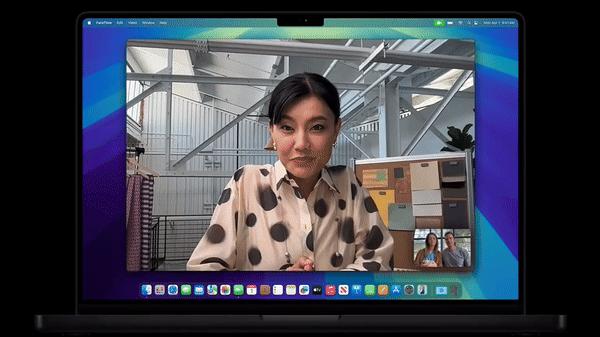 Person walks and talks as MacBook Pro M4 screen tracks their position via Apple's Center Stage tech