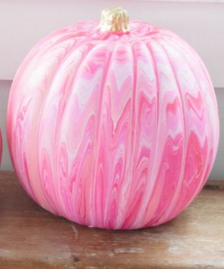 pink paint pouring pumpkin