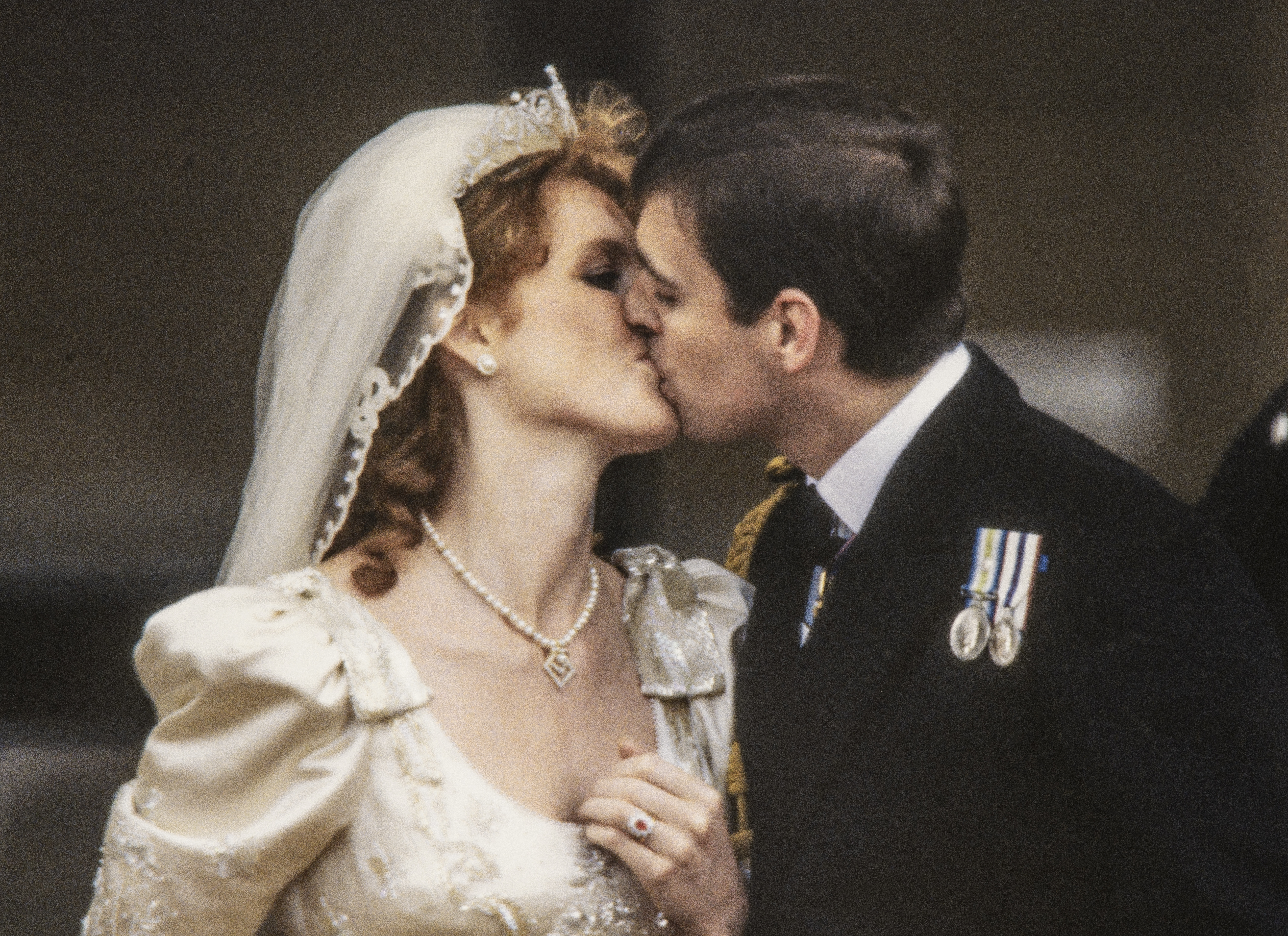 Sarah Ferguson and Prince Andrew kissing on their wedding day