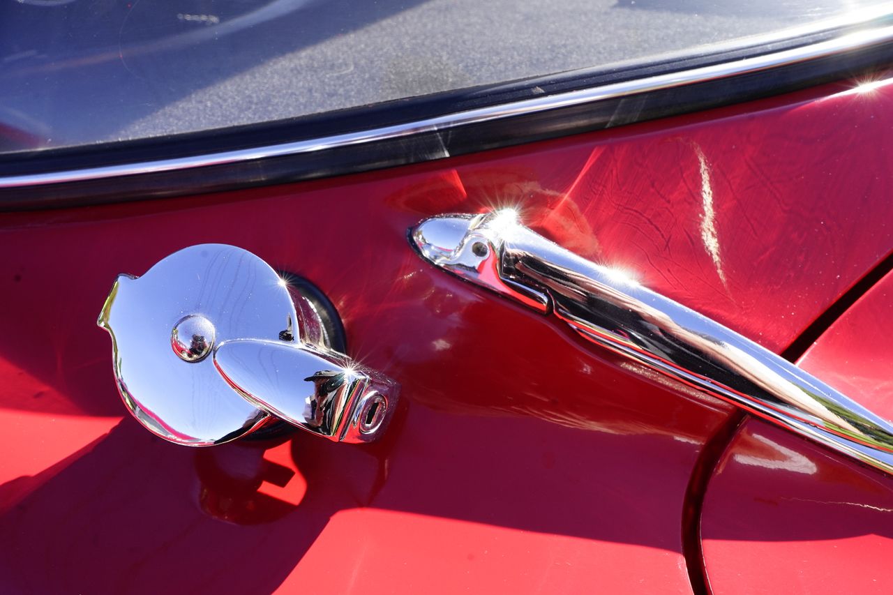 Chrome finishes on a bright red classic car