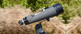 Celestron Skymaster 25x100 binoculars in use in the hand