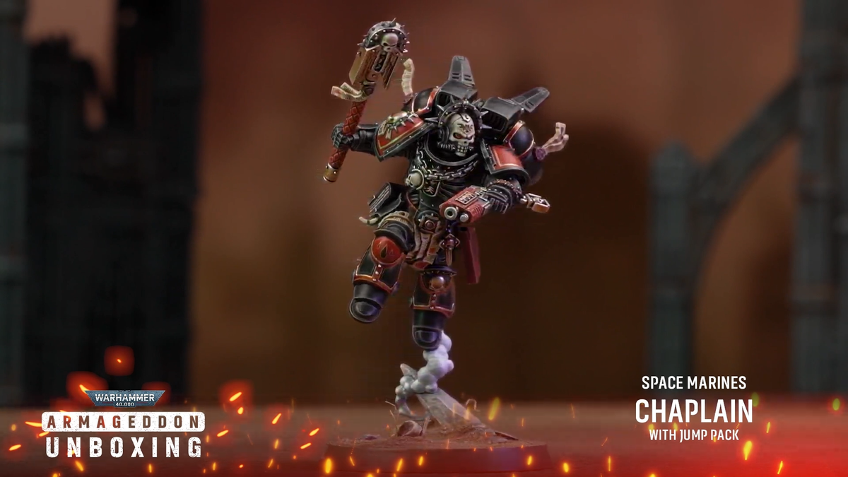 Warhammer 40K Space Marine models on a rocky battlefield