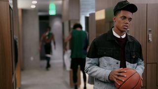 Jabari Banks as Will holding a basketball in the locker room in Bel-Air season 2