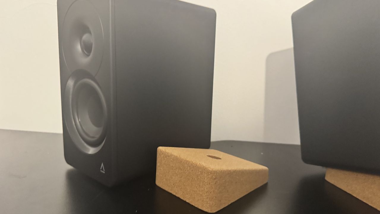 Creative XF1 speakers on a black desk