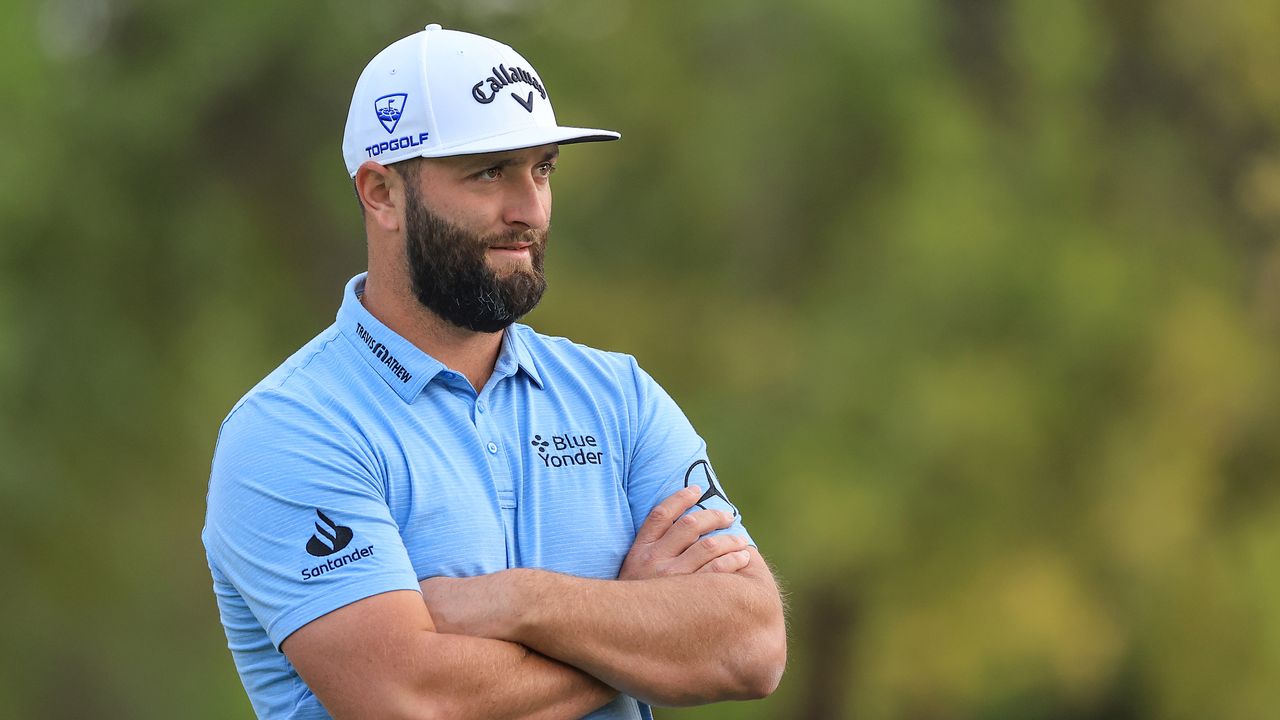 Jon Rahm with his arms crossed 