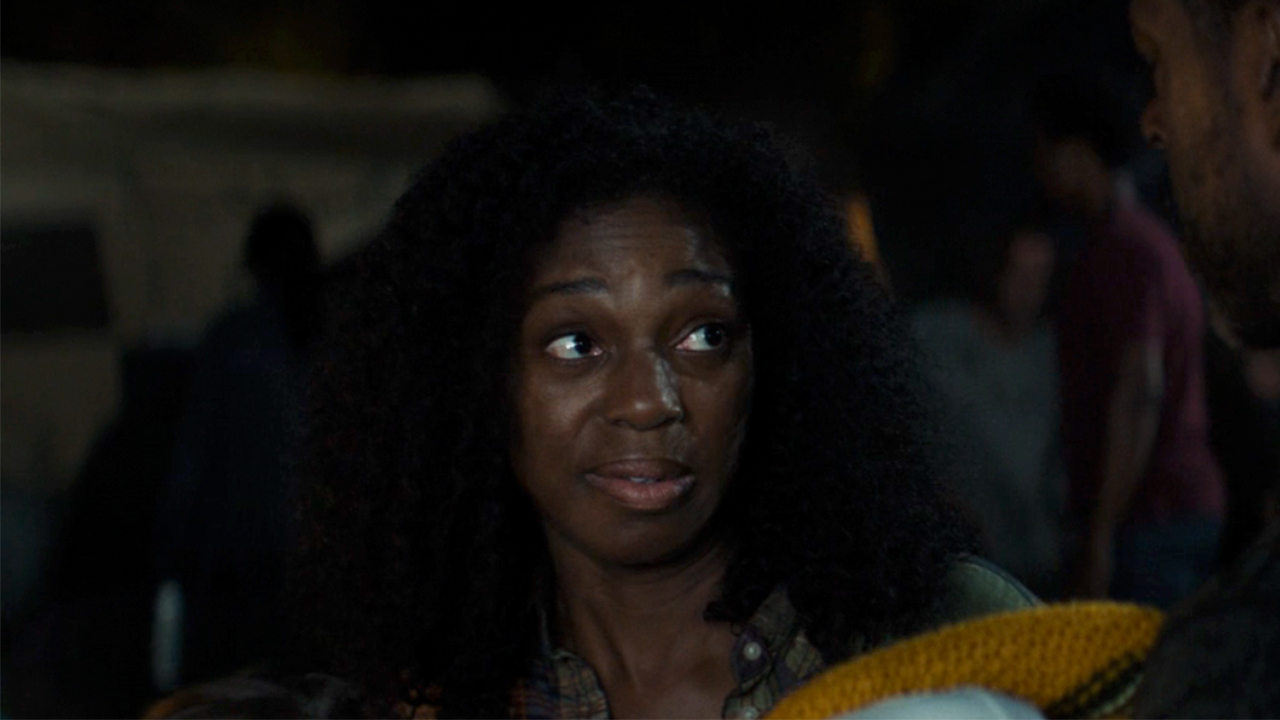 Enuka Okuma looking side-eyed on Paradise