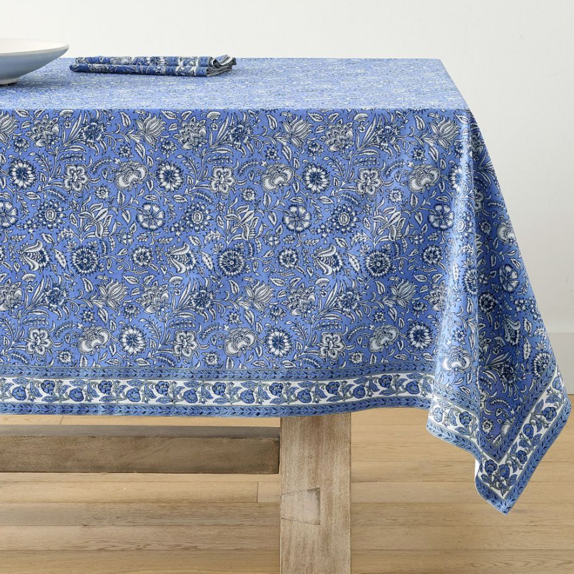 Blue floral tablecloth on a table
