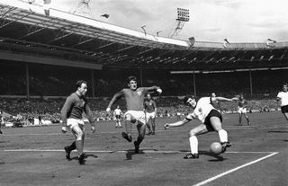 West Germany's Lothar Emmerich tries to get a shot away in the 1966 World Cup final against England at Wembley.