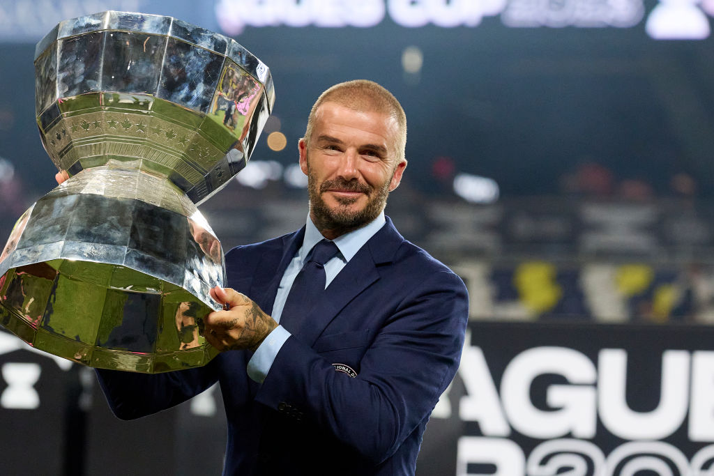 David Beckham of Inter Miami celebrates with the trophy after wining the Leagues Cup final football match against Nashville SC at Geodis Park in Nashville at GEODIS Park on August 19, 2023 in Nashville, Tennessee.