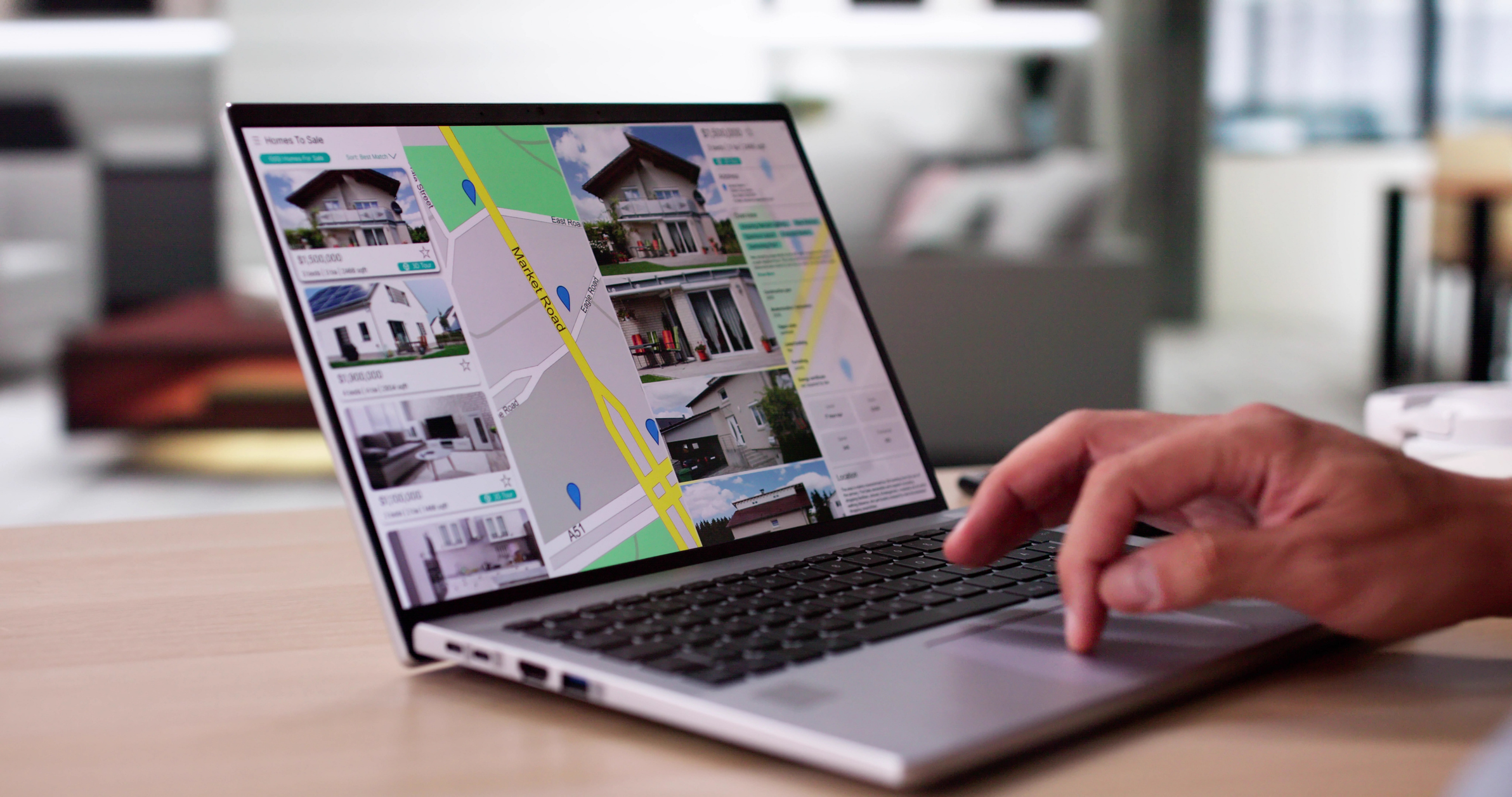 laptop with property listings on it