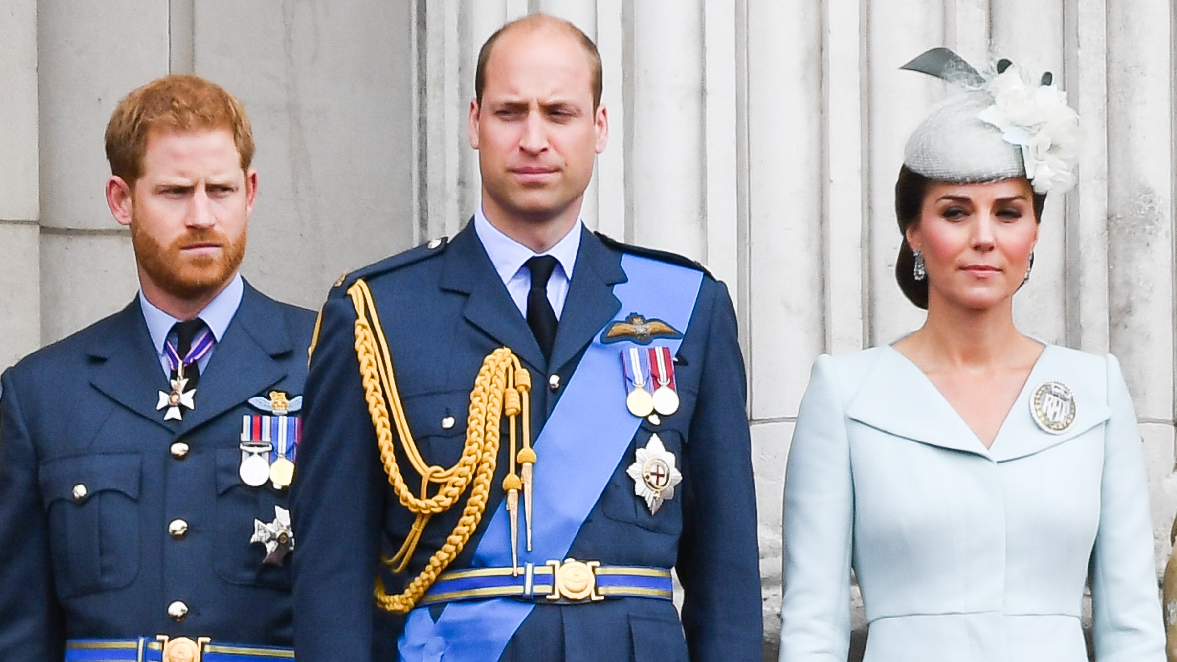 Prince Harry, Prince William and Catherine, Princess of Wales stand on the balcony of Buckingham Palace to view a flypast to mark the centenary of the Royal Air Force (RAF) on July 10, 2018