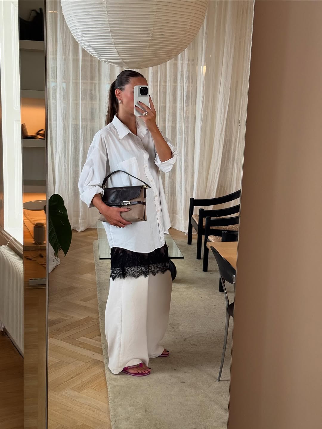 woman wearing dress over pants fall outfit 2025