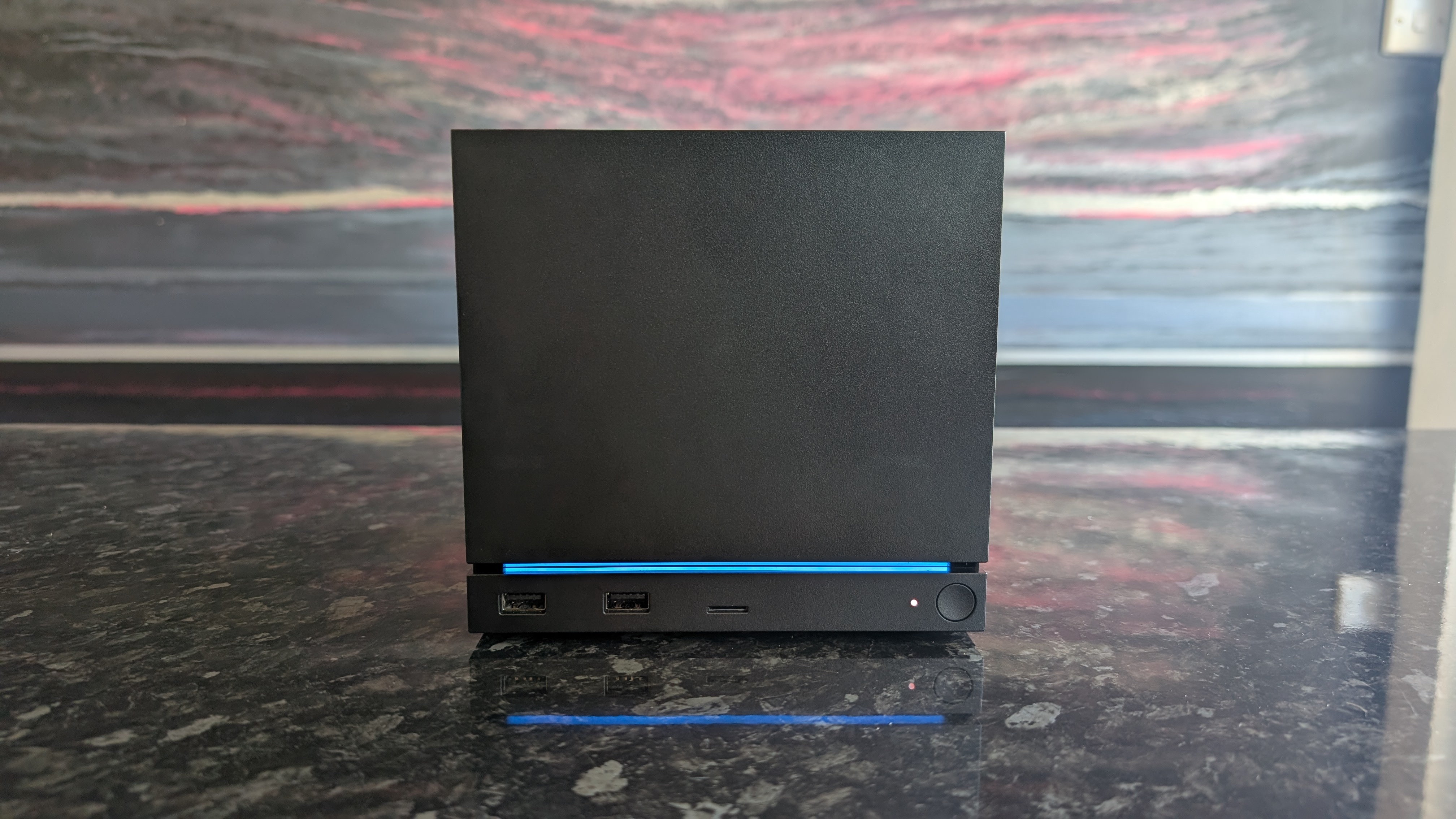 The Valve Steam Machine, pictured on a dark marble worktop.