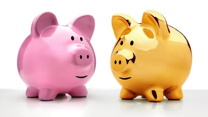 Two piggy banks, one pink, one gold, facing each other against a white background.