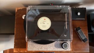 The Victrola Eastwood II turntable on a wooden surface.