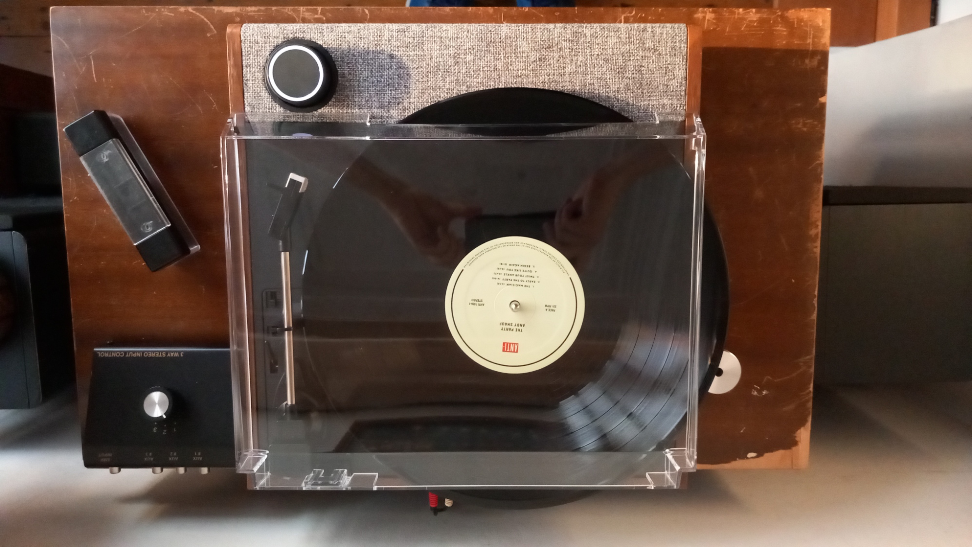 The Victrola Eastwood II turntable on a wooden surface.