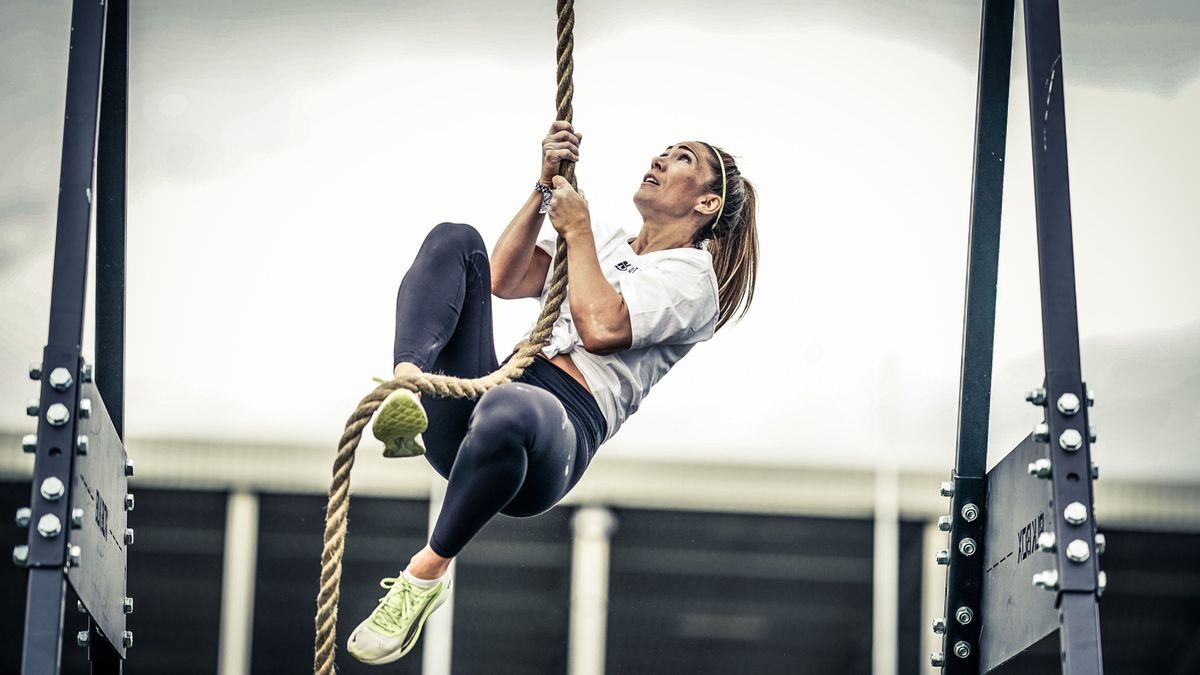 Megan Lovegrove climbing a rope