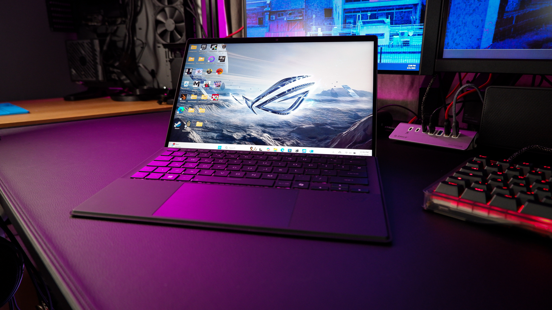 An ROG Flow Z13 (2025) set up on a desk with the detachable keyboard and charger.