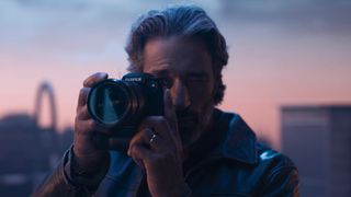 Man using Fujilfilm-X-H2S camera